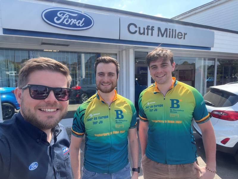 Michael Gates outside Cuff Miller with Jack and James raising money for St. Barnabas